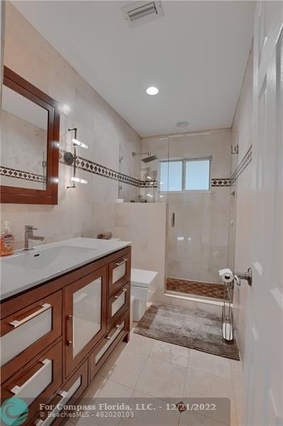 331 Southeast 4th Street Deerfield Beach, FL 33441 - Photo 27 of 37 a view of a storage & utility room with closet dryer and washer