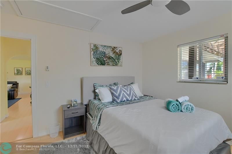 331 Southeast 4th Street Deerfield Beach, FL 33441 - Photo 29 of 37 a bedroom with a bed and a table