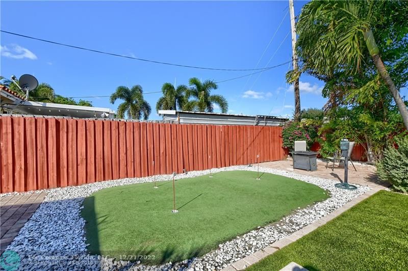 331 Southeast 4th Street Deerfield Beach, FL 33441 - Photo 36 of 37 a view of a backyard with a garden