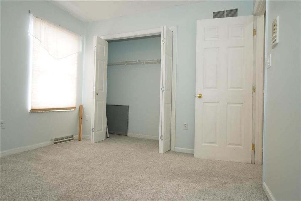 728 Mercer Street Pittsburgh, PA 15219 - Photo 16 of 27 an empty room with windows