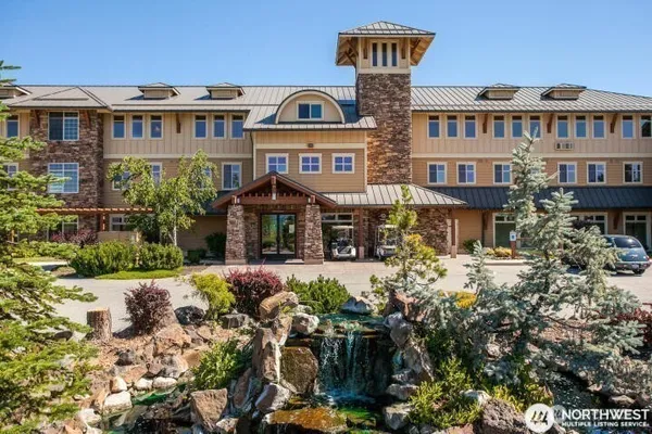 a front view of a residential apartment building with a yard