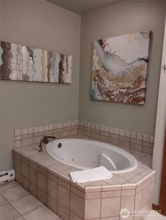 a bathroom with a bathtub and shower