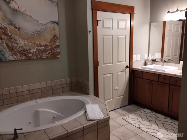 a bathroom with a bathtub and a sink