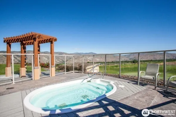 a swimming pool with outdoor seating