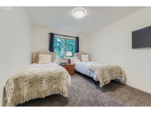 a bedroom with bed and a couch