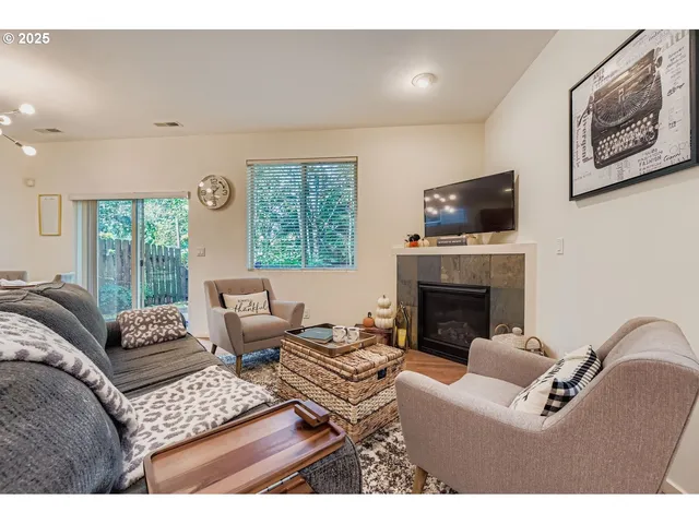 a living room with furniture a fireplace