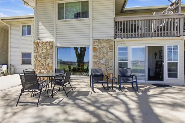 a view of a dinning tables and chairs in the patio