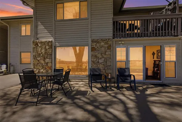 a view of a dinning tables and chairs in patio