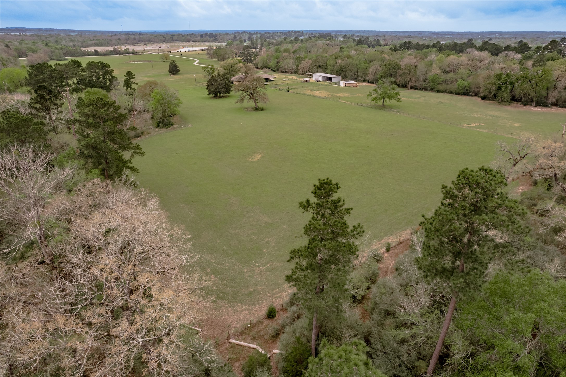 758 Wire Road Huntsville, TX 77320 - Photo 37 of 44 an aerial view of a houses with a lake view