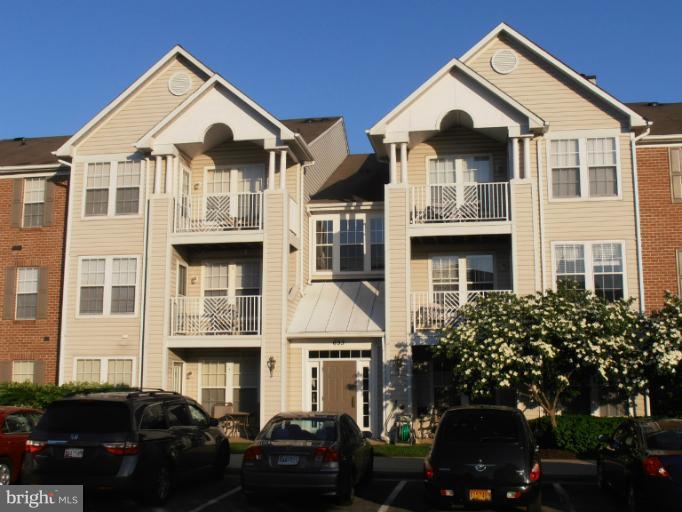 693 Winding Stream Way, Unit 302 Odenton, MD 21113 - Photo 1 of 26 a front view of multiple houses