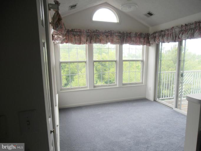 693 Winding Stream Way, Unit 302 Odenton, MD 21113 - Photo 12 of 26 a view of room with window and outdoor view