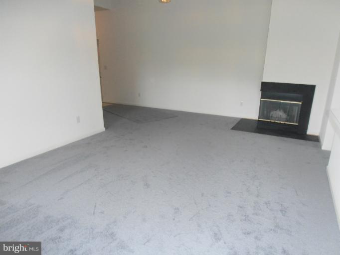 693 Winding Stream Way, Unit 302 Odenton, MD 21113 - Photo 7 of 26 a view of empty room with front door