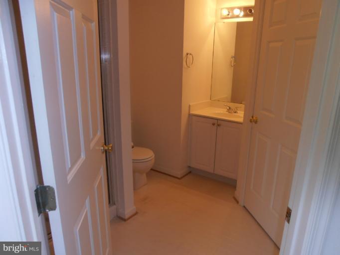 693 Winding Stream Way, Unit 302 Odenton, MD 21113 - Photo 9 of 26 a bathroom with a sink