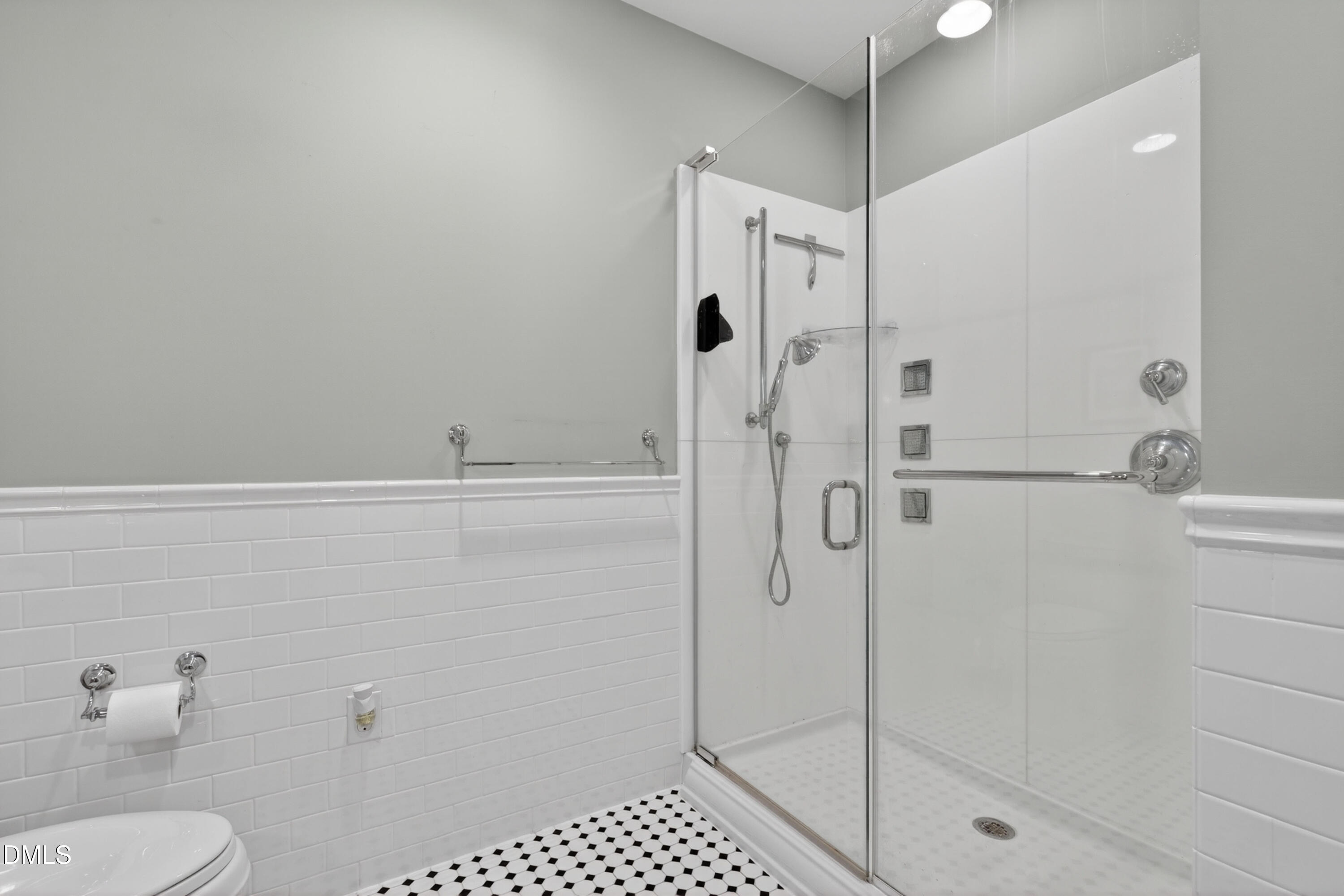 710 Independence Place, Unit 104 Raleigh, NC 27603 - Photo 20 of 34 a bathroom with a shower
