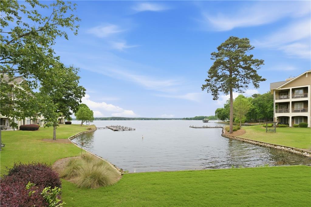 117 South Bay Road, Unit 402 Eatonton, GA 31024 - Photo 40 of 48 a view of a lake with a yard