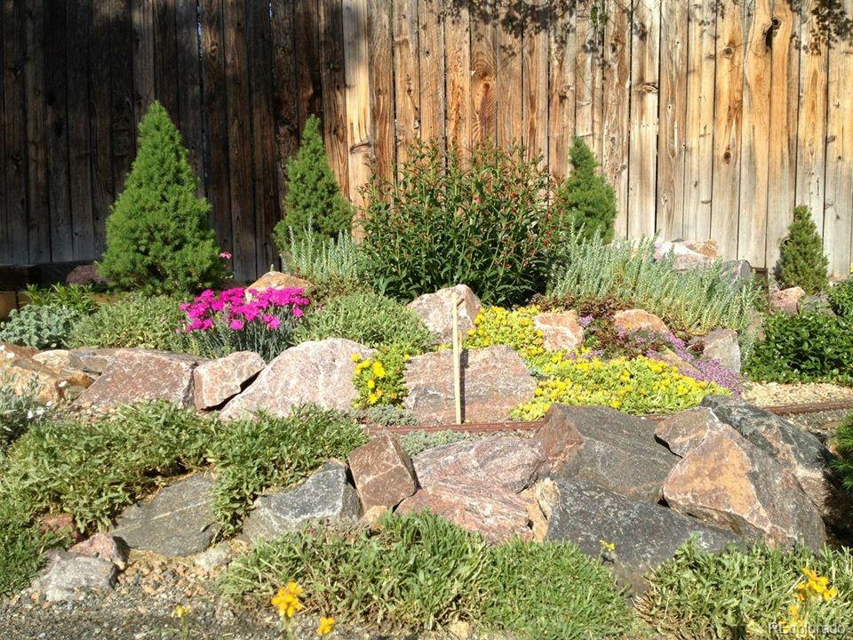 7928 Raleigh Place Westminster, CO 80030 - Photo 23 of 24 a view of a flower arrangement in backyard