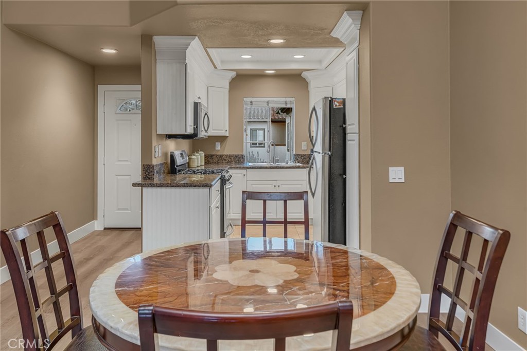 28 Vía Contento Rancho Santa Margarita, CA 92688 - Photo 11 of 61 a view of a dining room with furniture and wooden floor