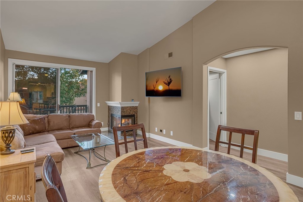 28 Vía Contento Rancho Santa Margarita, CA 92688 - Photo 13 of 61 a living room with furniture and a flat screen tv