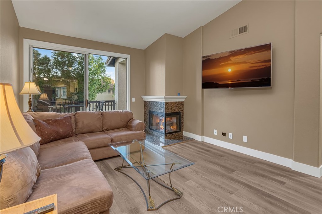 28 Vía Contento Rancho Santa Margarita, CA 92688 - Photo 17 of 61 a living room with furniture and a flat screen tv