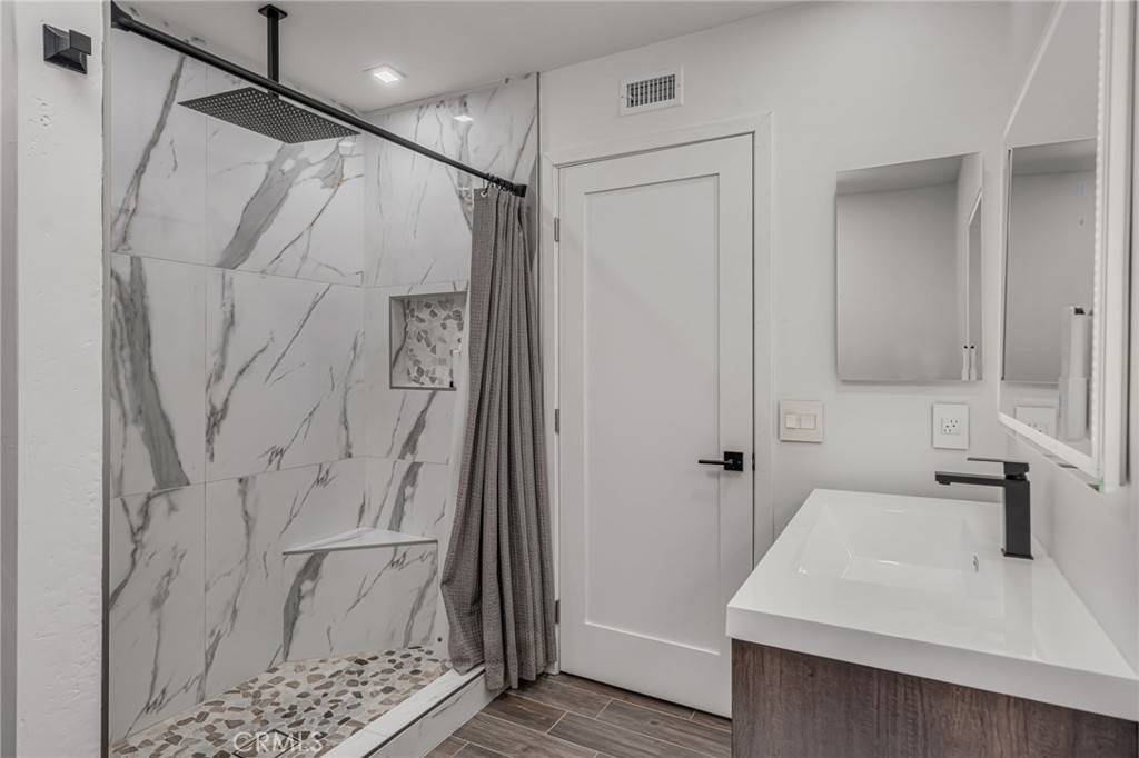 28 Vía Contento Rancho Santa Margarita, CA 92688 - Photo 21 of 61 a bathroom with a sink toilet and shower