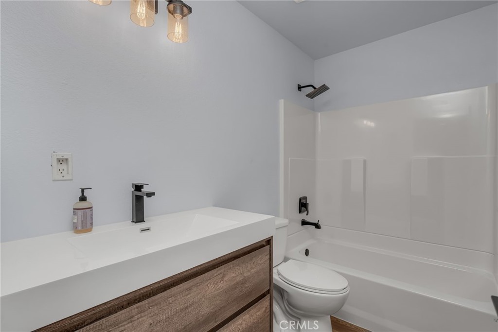 28 Vía Contento Rancho Santa Margarita, CA 92688 - Photo 27 of 61 a bathroom with a sink a toilet and a bathtub