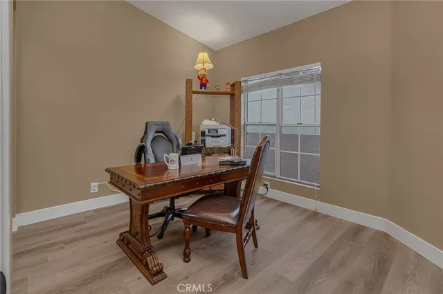 a bedroom with furniture and a window