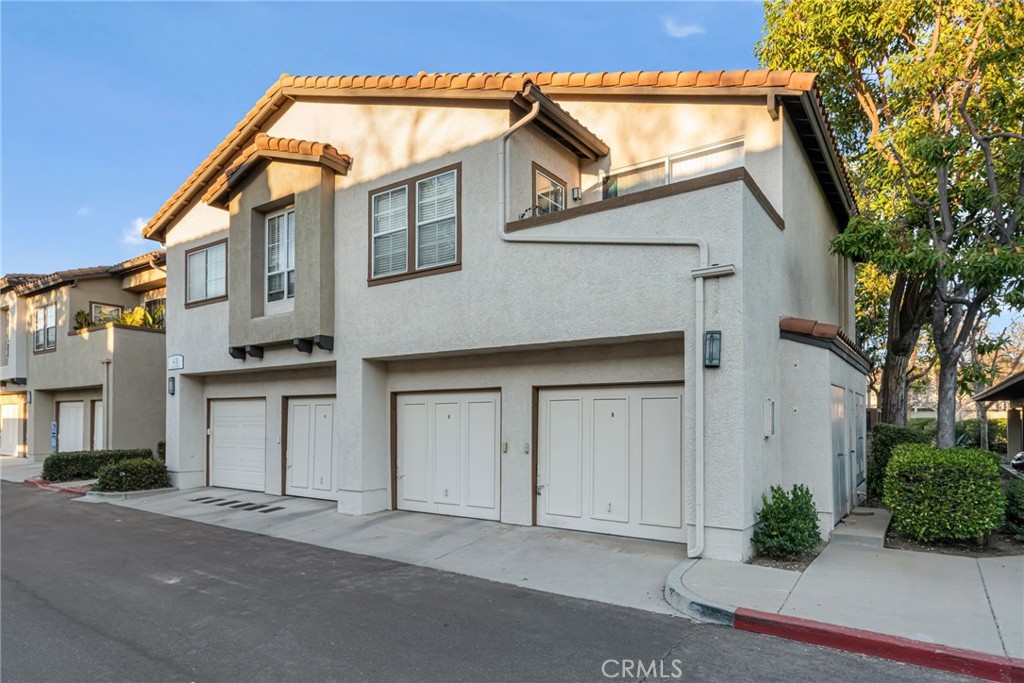 28 Vía Contento Rancho Santa Margarita, CA 92688 - Photo 37 of 61 a front view of a house with garden