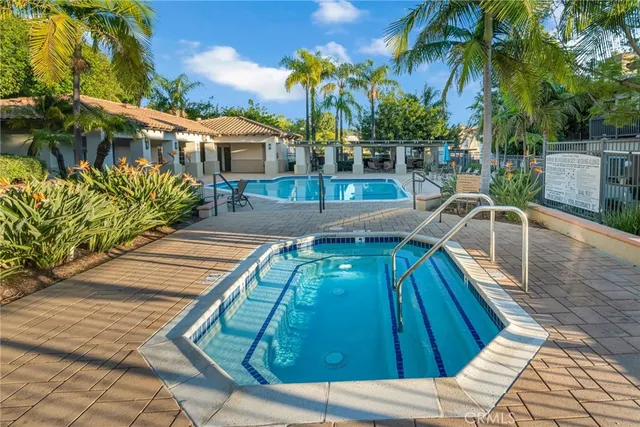 a view of a swimming pool with a lounge chairs