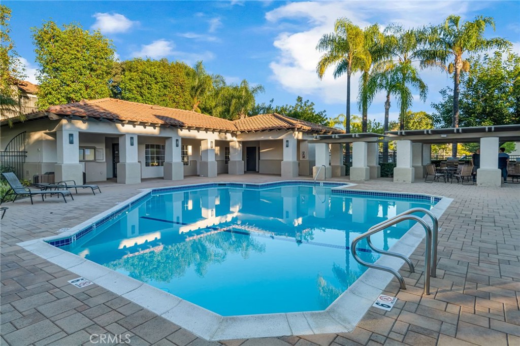 28 Vía Contento Rancho Santa Margarita, CA 92688 - Photo 44 of 61 a view of a house with pool and chairs