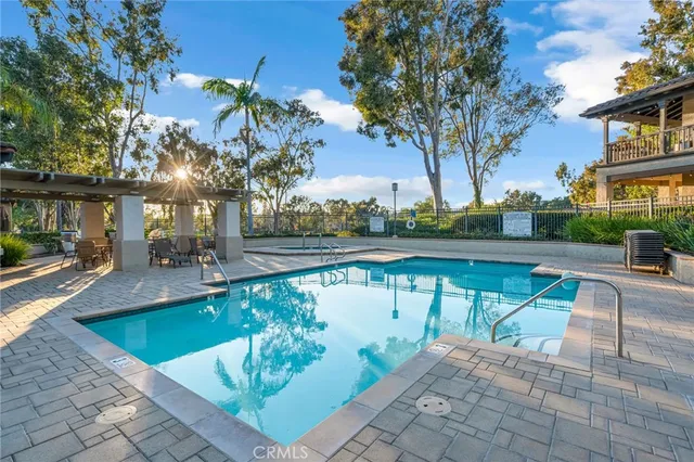 a view of a patio with swimming pool table and chairs