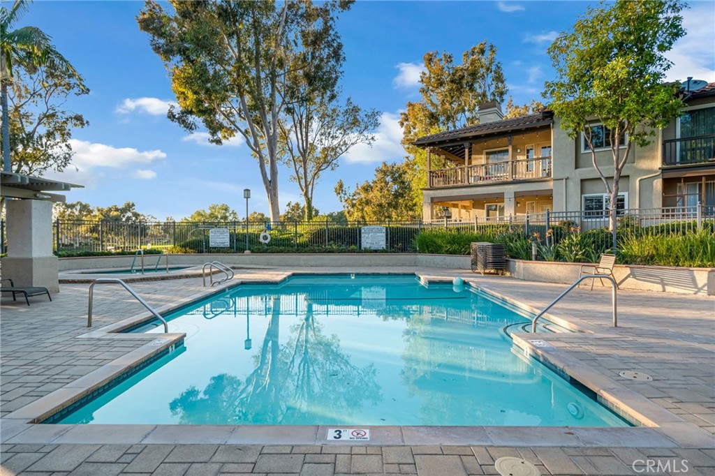 28 Vía Contento Rancho Santa Margarita, CA 92688 - Photo 46 of 61 a view of a swimming pool with a lounge chairs