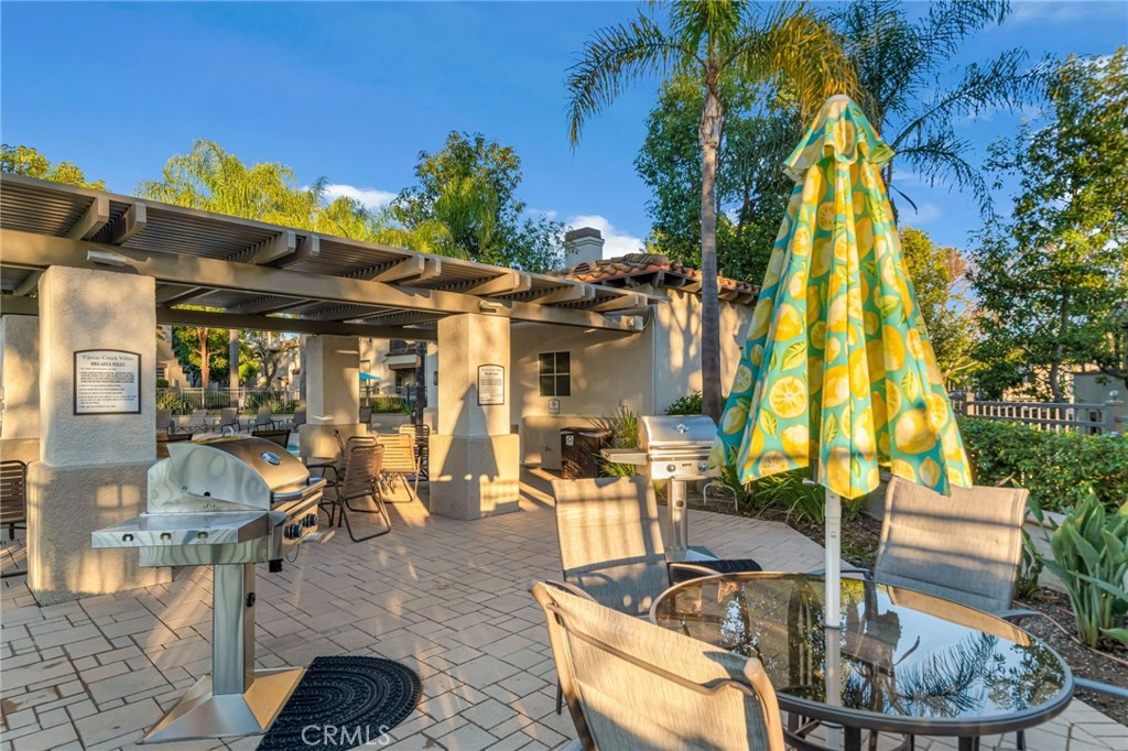 28 Vía Contento Rancho Santa Margarita, CA 92688 - Photo 49 of 61 a view of a patio with swimming pool table and chairs