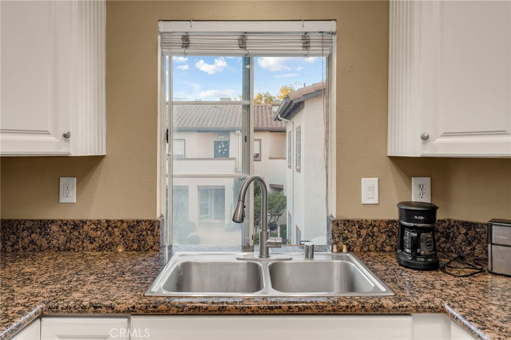 28 Vía Contento Rancho Santa Margarita, CA 92688 - Photo 7 of 61 a kitchen with a sink and cabinets