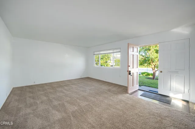 an empty room with windows