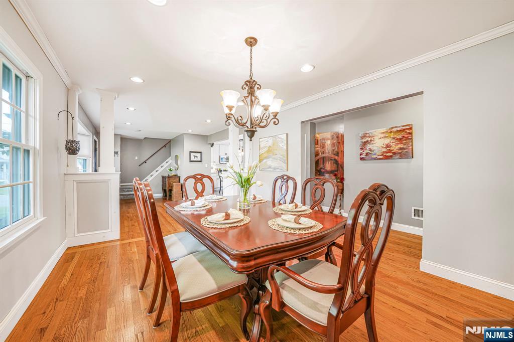 30 Oakley Way Wayne, NJ 07470 - Photo 11 of 43 a view of a dining room with furniture and chandelier