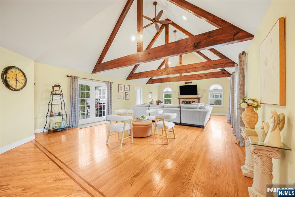 30 Oakley Way Wayne, NJ 07470 - Photo 12 of 43 a living room with furniture a fireplace and wooden floor