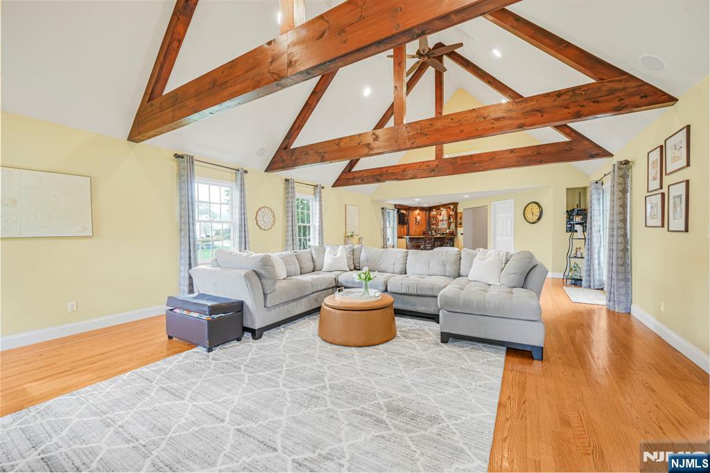 30 Oakley Way Wayne, NJ 07470 - Photo 14 of 43 a living room with furniture and a floor to ceiling window