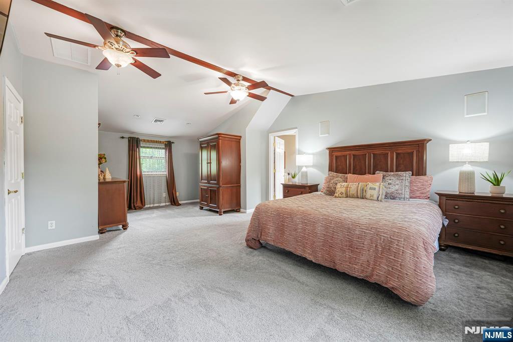 30 Oakley Way Wayne, NJ 07470 - Photo 20 of 43 a bedroom with a large bed and window