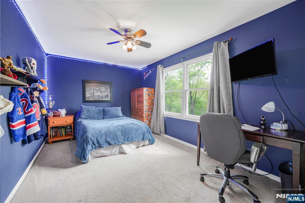 30 Oakley Way Wayne, NJ 07470 - Photo 25 of 43 a bedroom with a bed and large windows