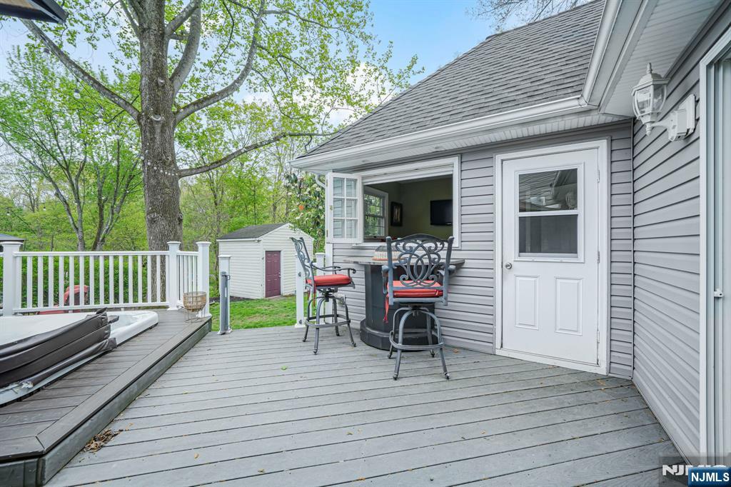30 Oakley Way Wayne, NJ 07470 - Photo 35 of 43 a view of house with deck outdoor seating and green space