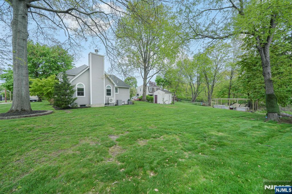 30 Oakley Way Wayne, NJ 07470 - Photo 39 of 43 a view of white house with yard