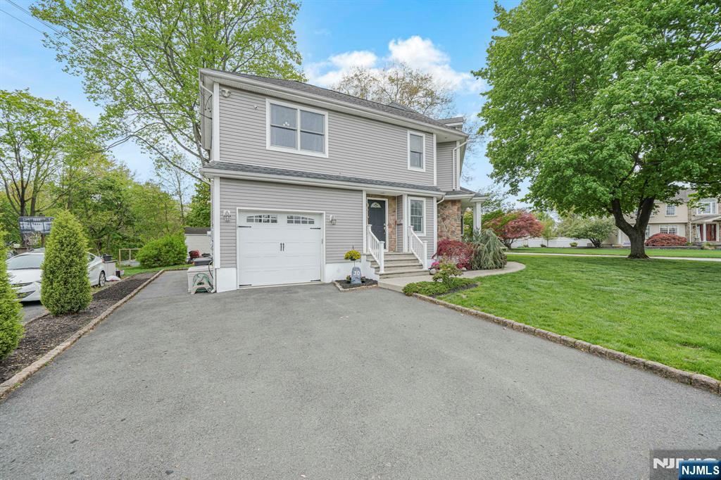 30 Oakley Way Wayne, NJ 07470 - Photo 40 of 43 a view of an house with backyard and a tree