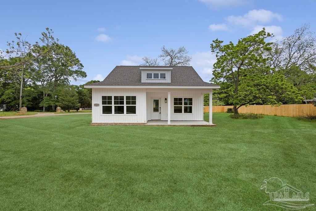 5307 Edeker Circle Jay, FL 32565 - Photo 1 of 28 a front view of a house with a garden