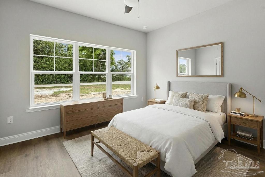 5307 Edeker Circle Jay, FL 32565 - Photo 15 of 28 a bedroom with a bed and a large window
