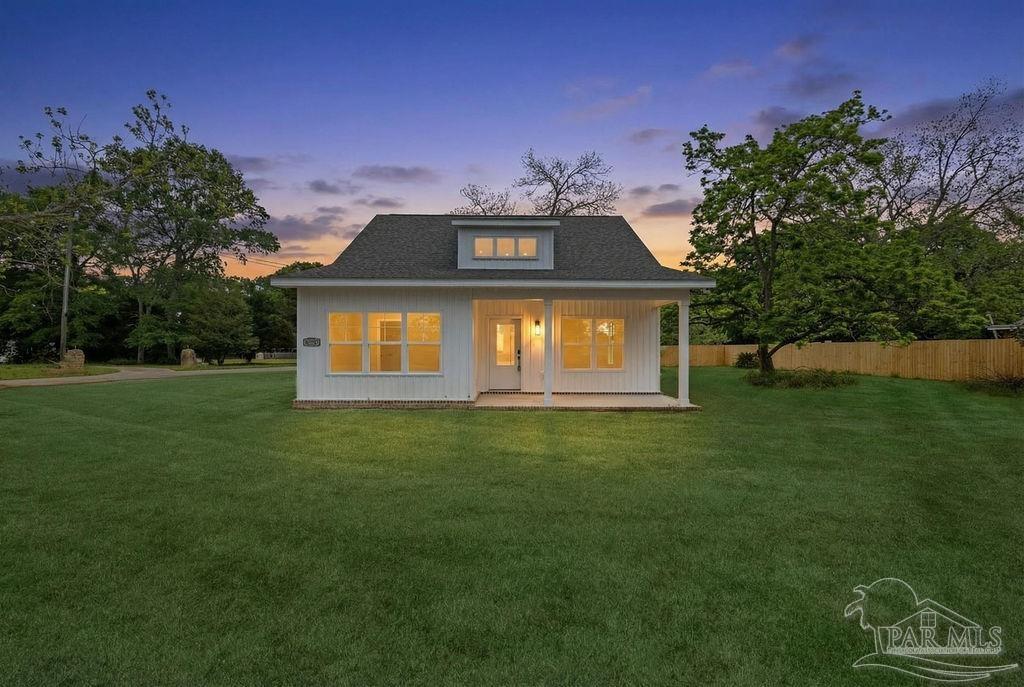 5307 Edeker Circle Jay, FL 32565 - Photo 2 of 28 a front view of a house with a garden