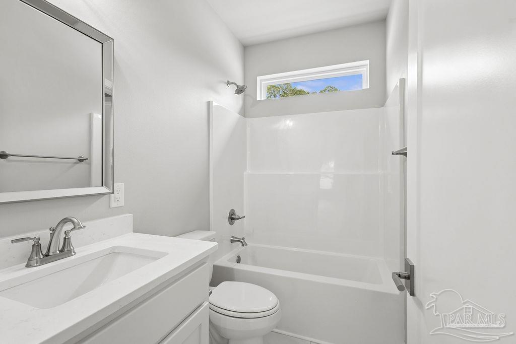 5307 Edeker Circle Jay, FL 32565 - Photo 22 of 28 a bathroom with a sink a toilet and shower