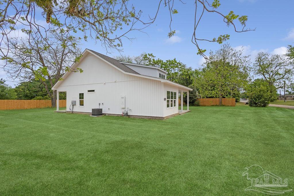 5307 Edeker Circle Jay, FL 32565 - Photo 26 of 28 a view of a house with backyard and garden