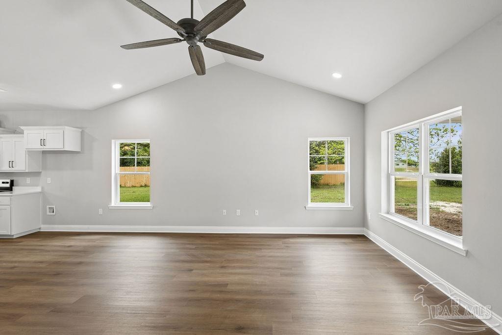 5307 Edeker Circle Jay, FL 32565 - Photo 5 of 28 a view of an empty room with a window and wooden floor