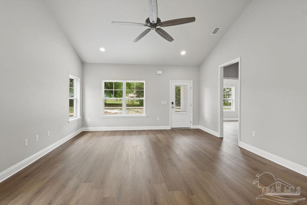 5307 Edeker Circle Jay, FL 32565 - Photo 7 of 28 wooden floor in an empty room with a window