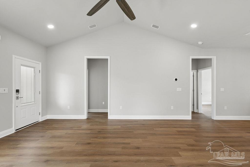 5307 Edeker Circle Jay, FL 32565 - Photo 8 of 28 an empty room with wooden floor and windows